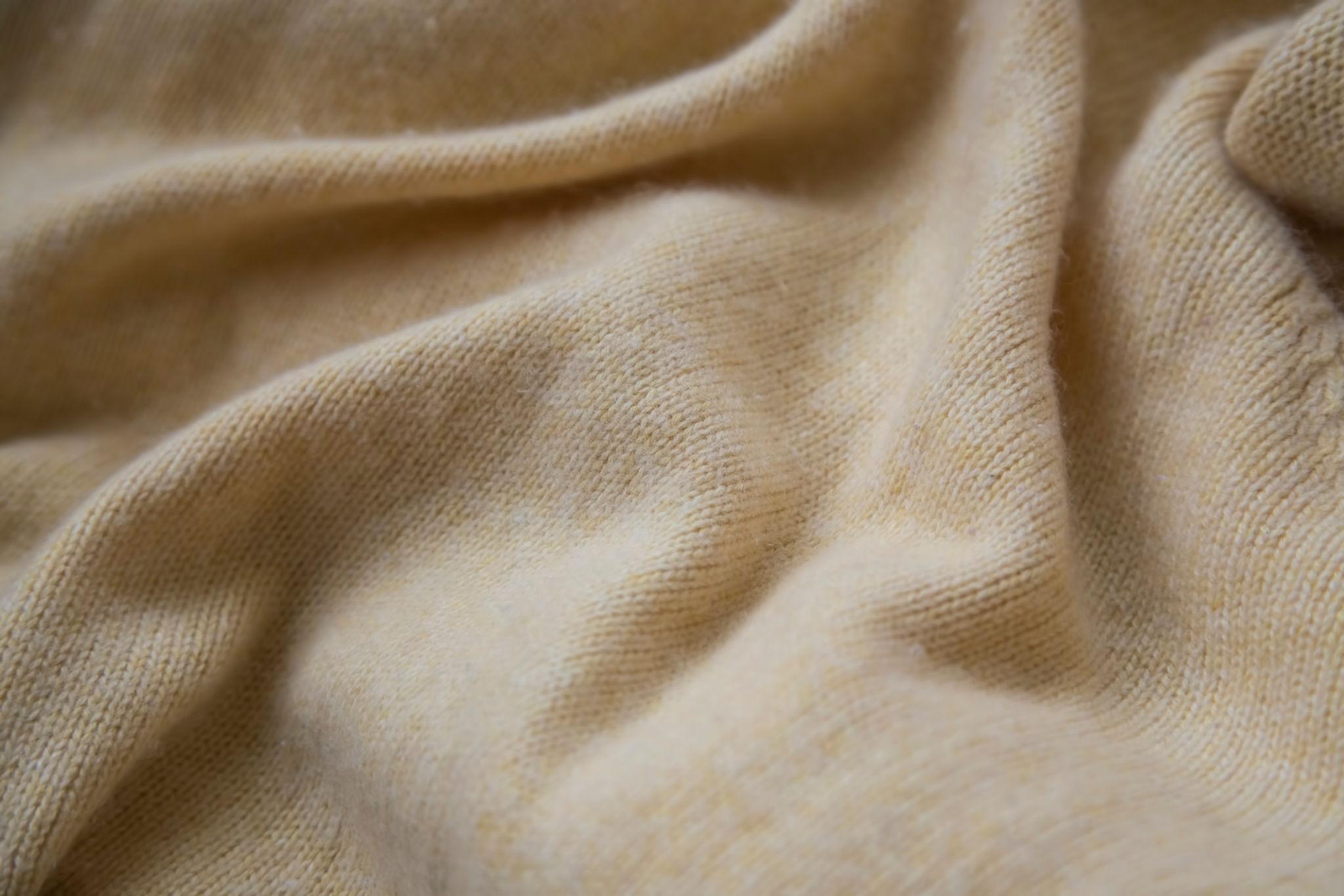 Soft fabric in natural light representing clean, airy and textile-inspired perfume scents