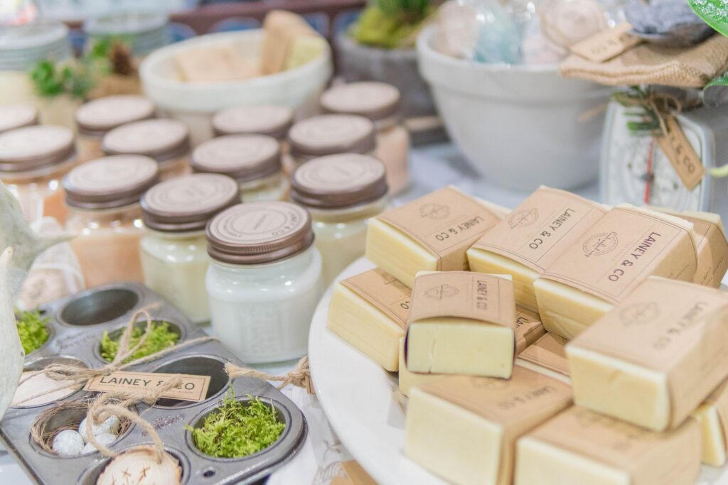 your skin but better perfume represented by clean cosmetics vials, soaps and herbs